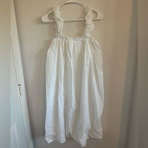 Vintage white dress, hits below the knee.